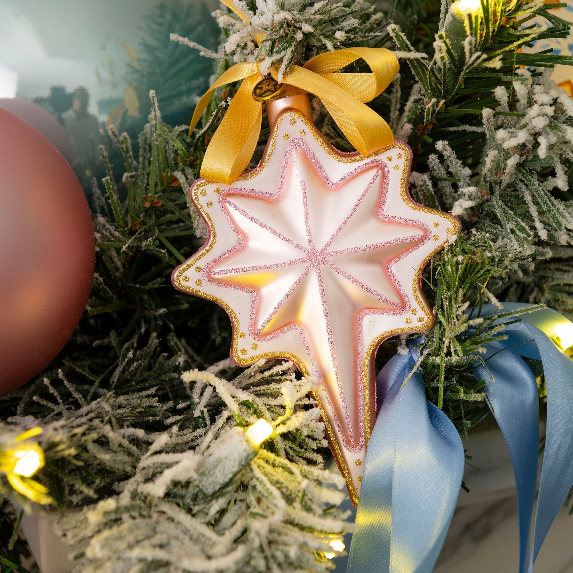 Christian star ornament with hand-painted details